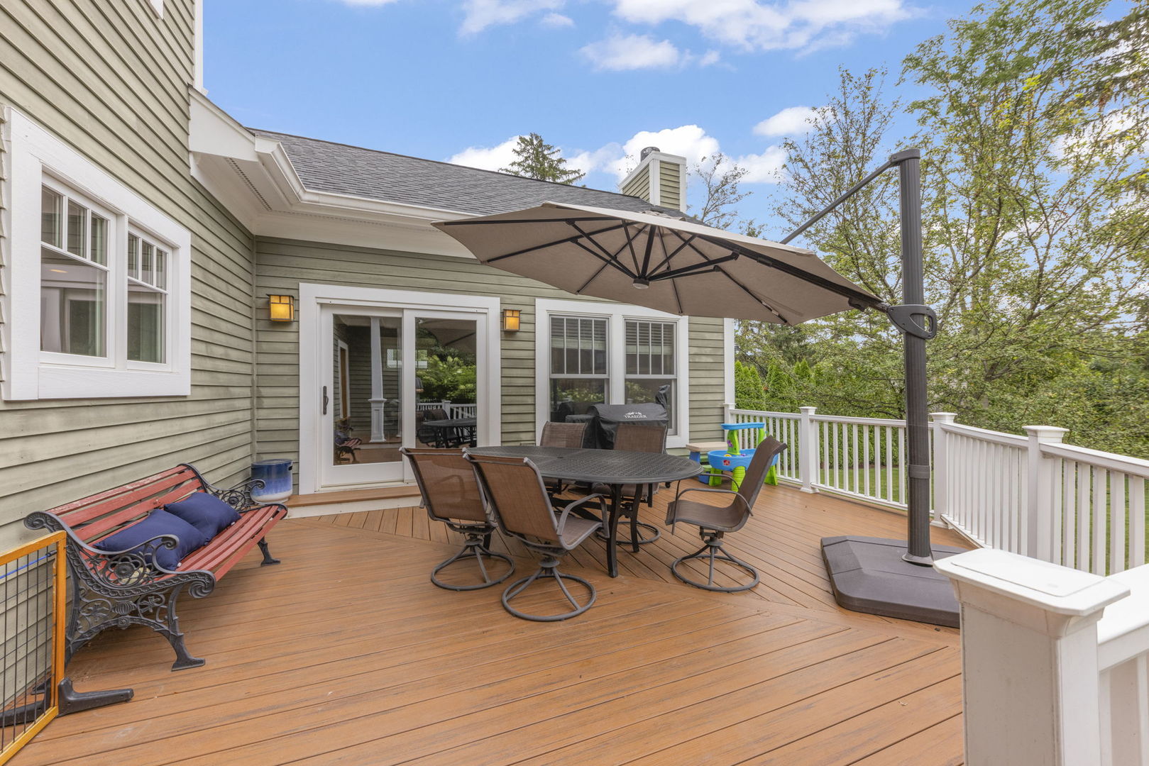 900 East Indiana Street Wheaton, IL 60187 - Photo 42 of 54 a view of a patio with table and chairs and wooden floor