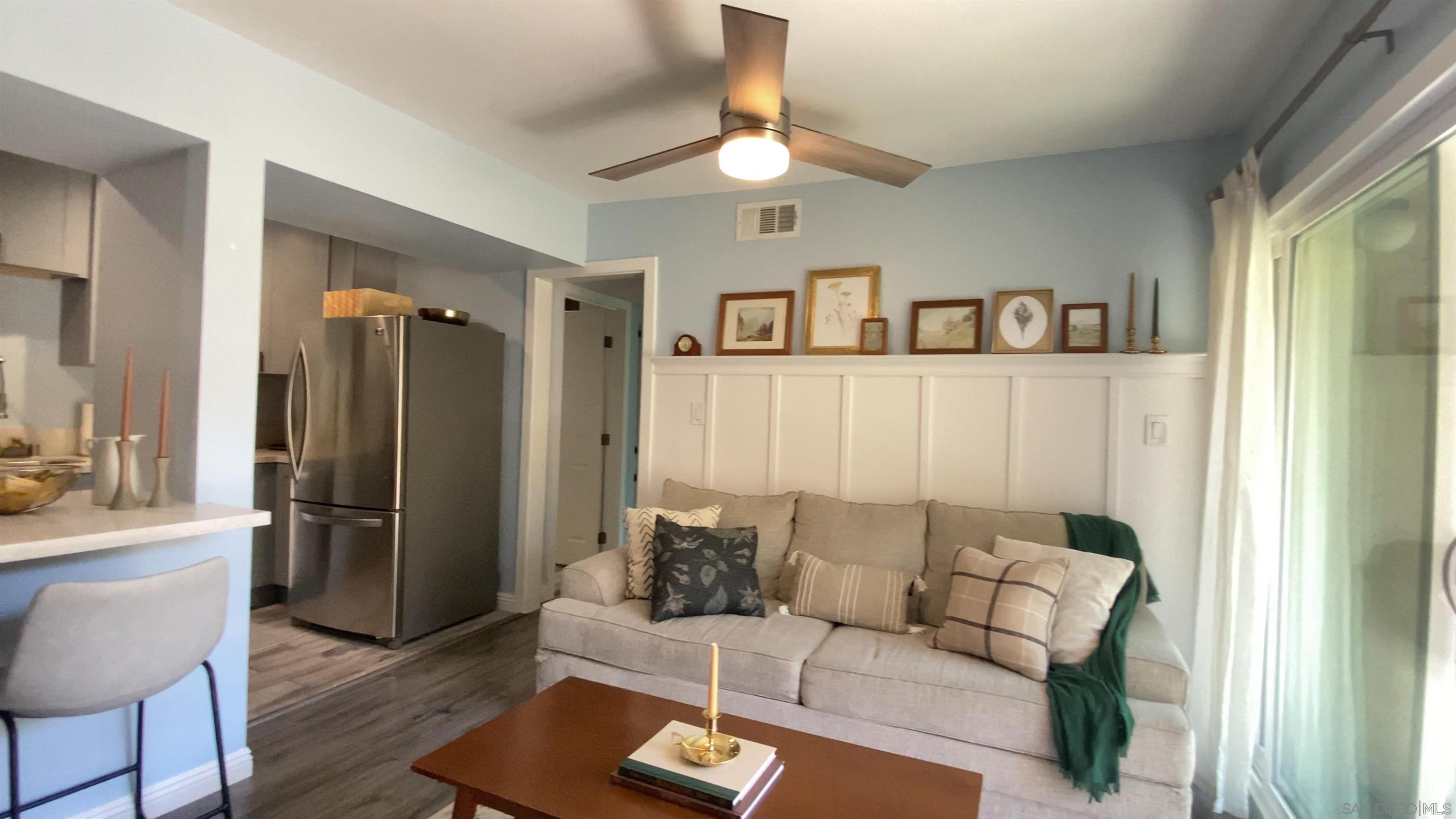 a living room with furniture and a window