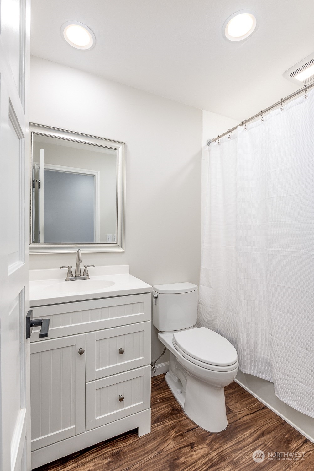 3016 Southwest 325th Place Federal Way, WA 98023 - Photo 13 of 40 a bathroom with a toilet a sink and a mirror