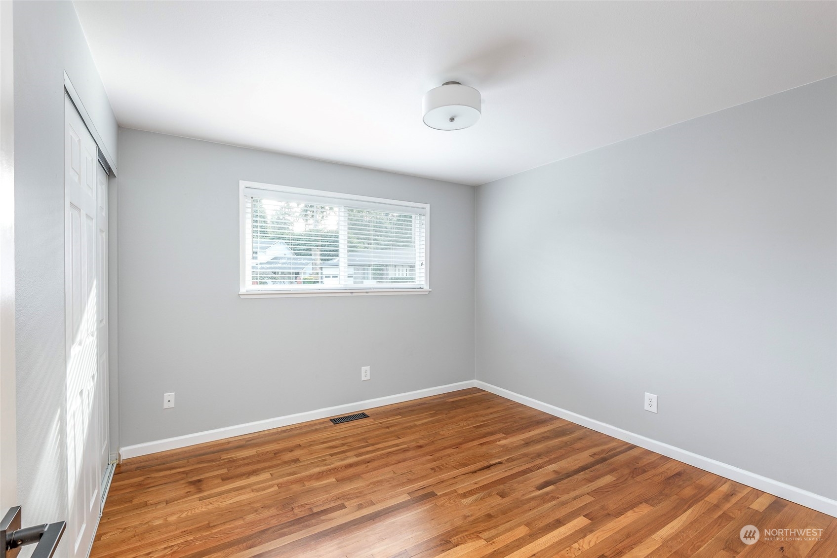 3016 Southwest 325th Place Federal Way, WA 98023 - Photo 14 of 40 an empty room with wooden floor and windows