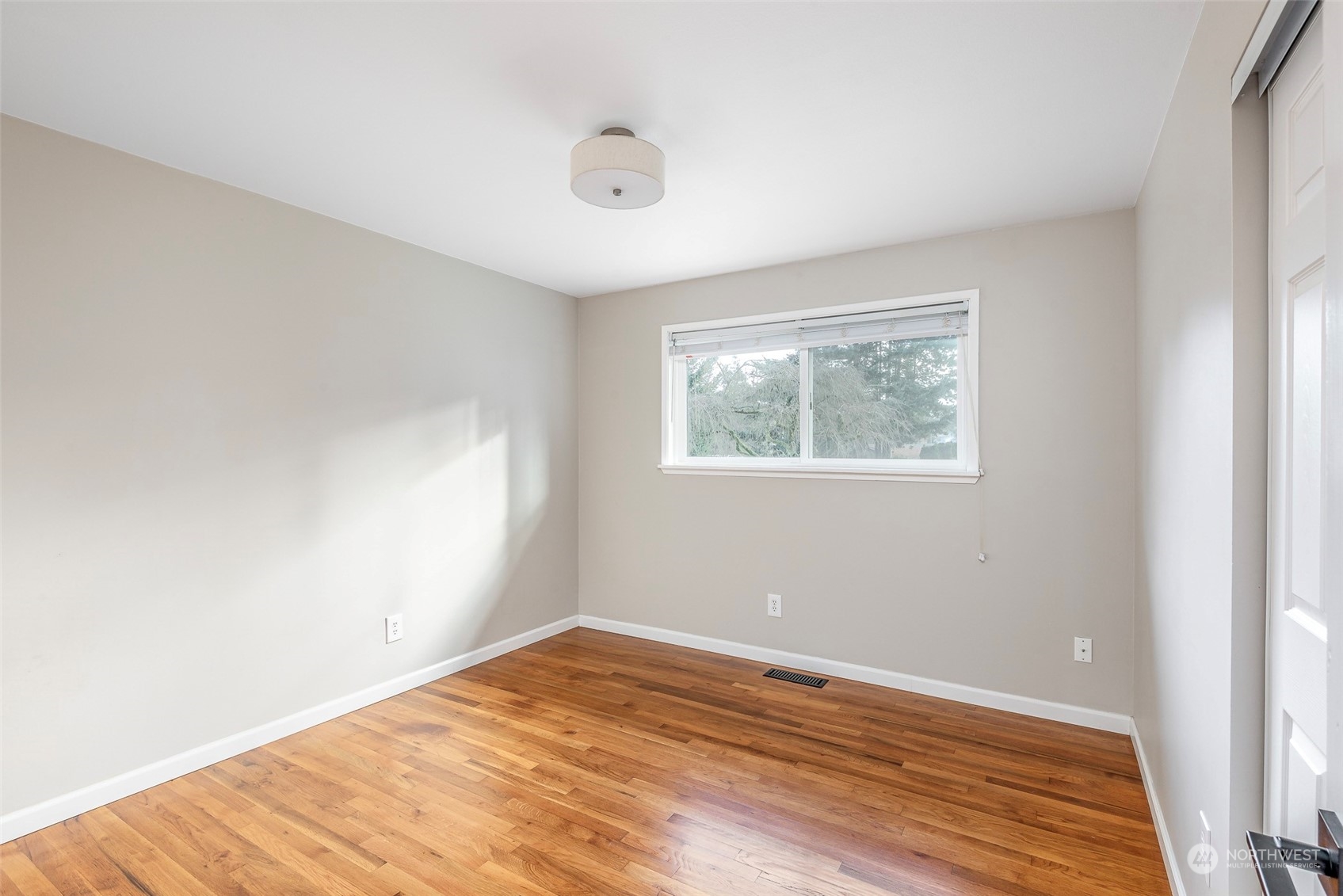 3016 Southwest 325th Place Federal Way, WA 98023 - Photo 15 of 40 a view of empty room with wooden floor and fan