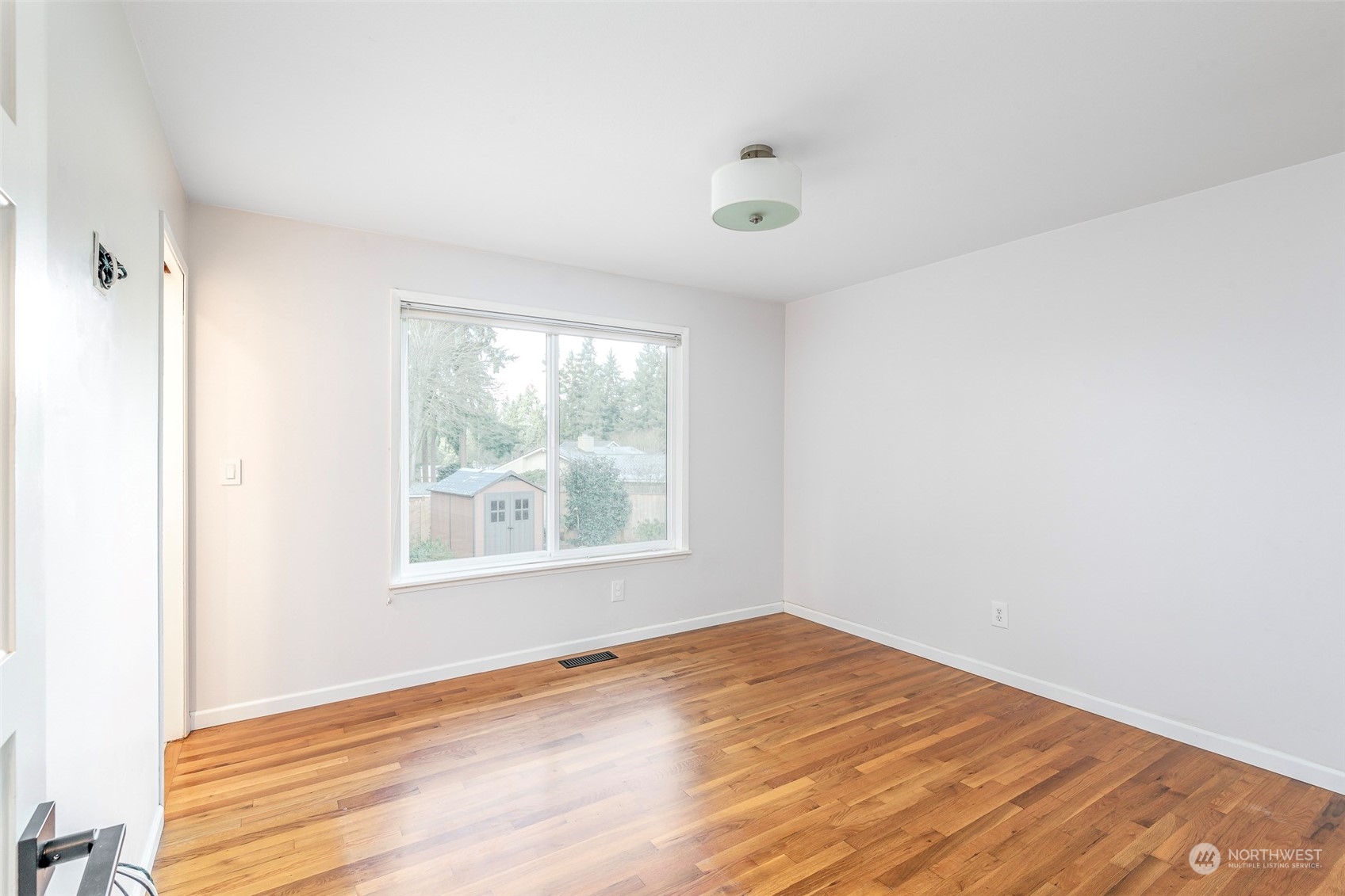 3016 Southwest 325th Place Federal Way, WA 98023 - Photo 16 of 40 an empty room with wooden floor and windows