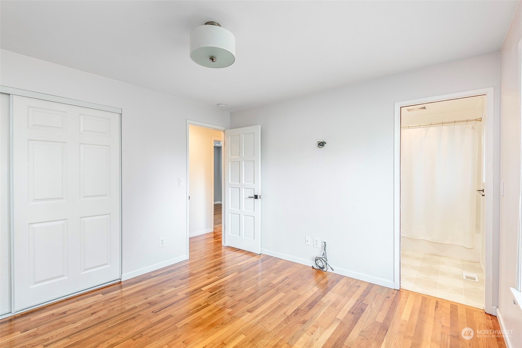 3016 Southwest 325th Place Federal Way, WA 98023 - Photo 17 of 40 a view of empty room with wooden floor