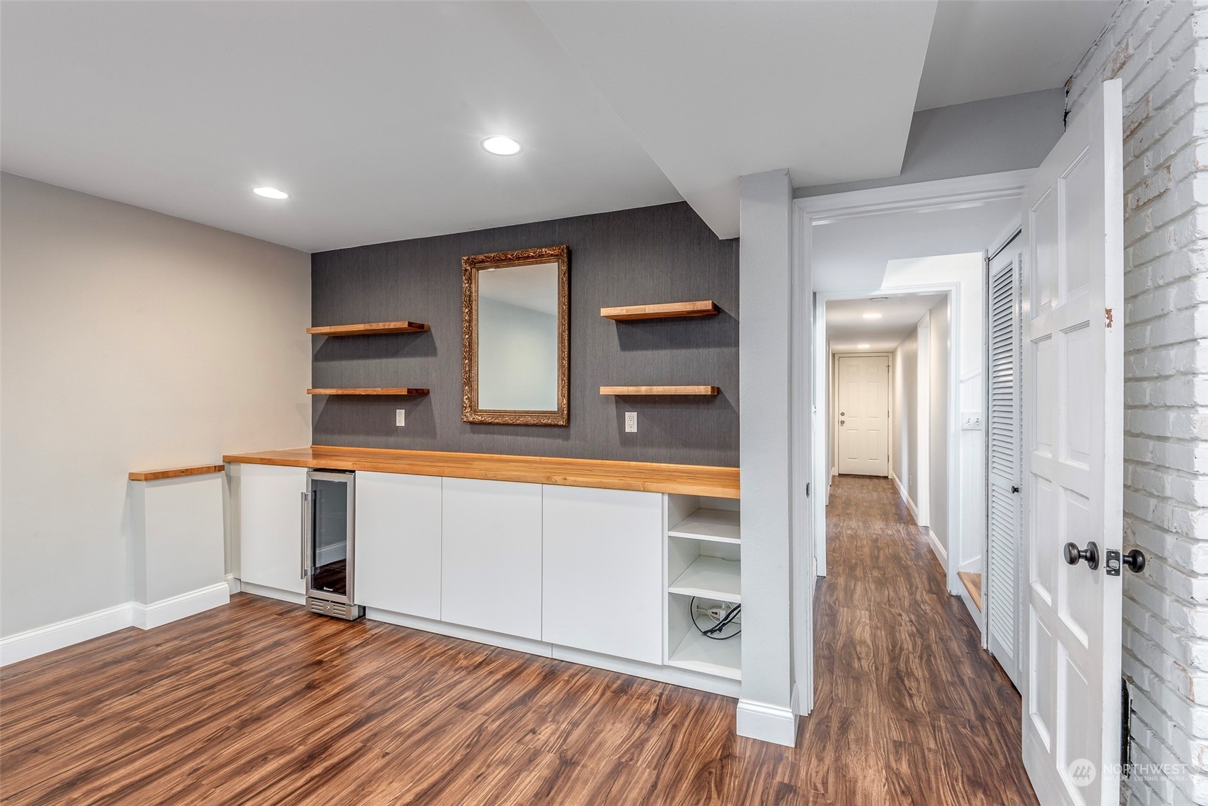 3016 Southwest 325th Place Federal Way, WA 98023 - Photo 19 of 40 a view of a hallway with wooden floor and staircase
