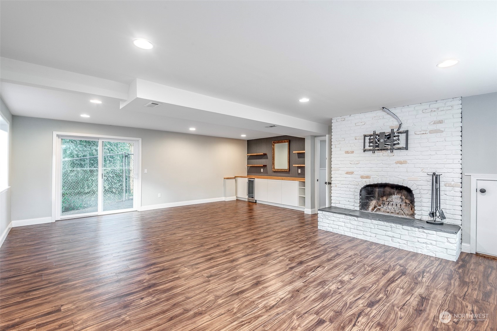 3016 Southwest 325th Place Federal Way, WA 98023 - Photo 21 of 40 a view of a livingroom with a fireplace window and wooden floor
