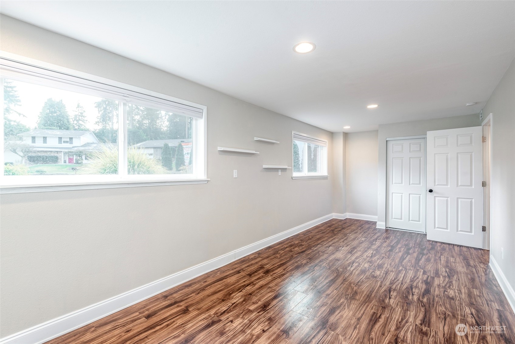3016 Southwest 325th Place Federal Way, WA 98023 - Photo 23 of 40 a view of an empty room with wooden floor and a window
