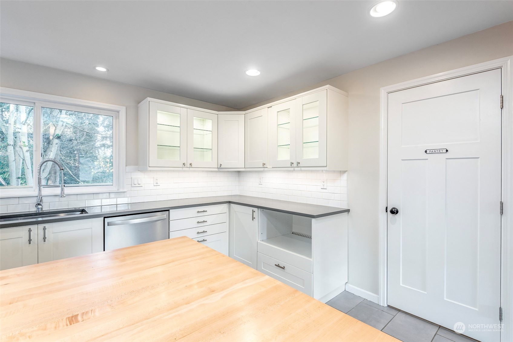 3016 Southwest 325th Place Federal Way, WA 98023 - Photo 6 of 40 a kitchen with a sink stove and cabinets