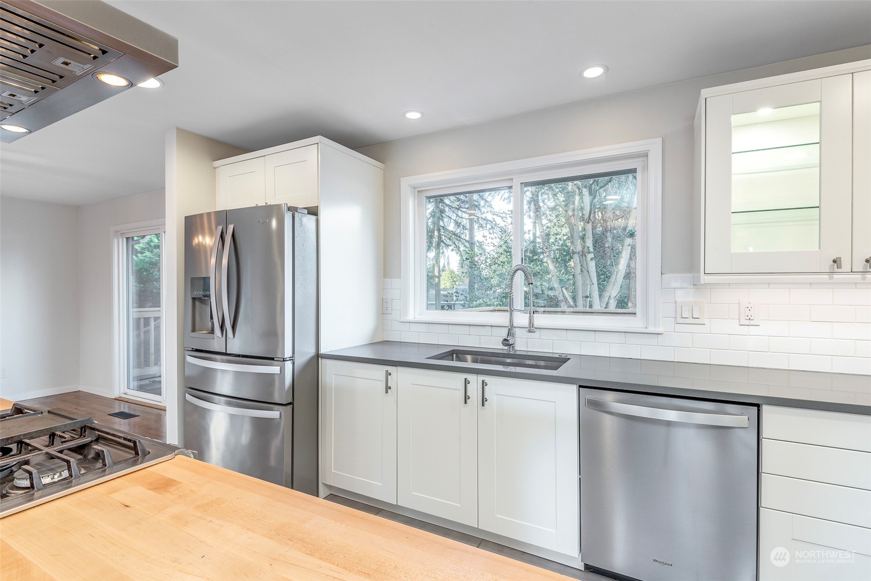 3016 Southwest 325th Place Federal Way, WA 98023 - Photo 8 of 40 a kitchen with stainless steel appliances granite countertop a sink a stove and a refrigerator