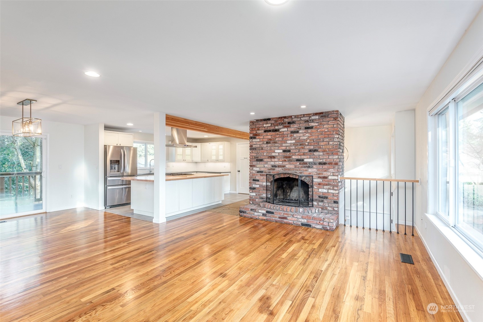 3016 Southwest 325th Place Federal Way, WA 98023 - Photo 9 of 40 a view of a livingroom with wooden floor and a fireplace