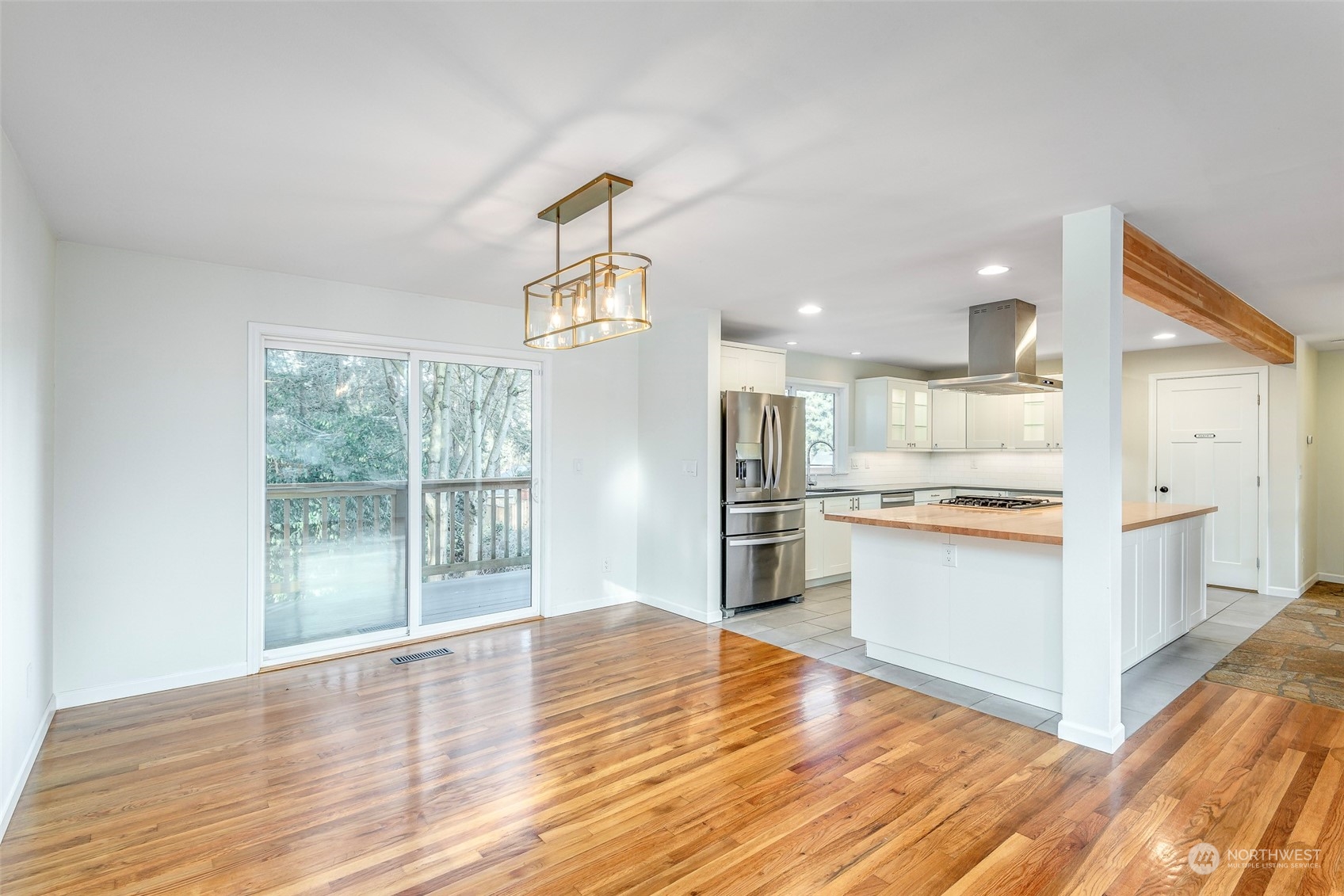 3016 Southwest 325th Place Federal Way, WA 98023 - Photo 10 of 40 a open kitchen with white cabinets and wooden floor