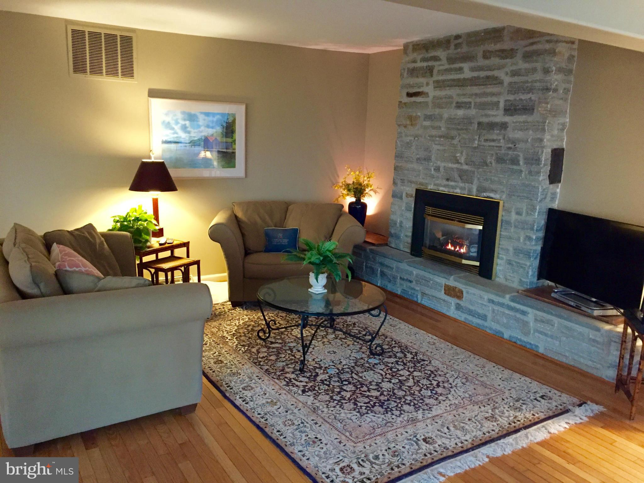 2025 Bay Road Pasadena, MD 21122 - Photo 8 of 30 Hardwood Floors, Stone and Gas Fireplace
