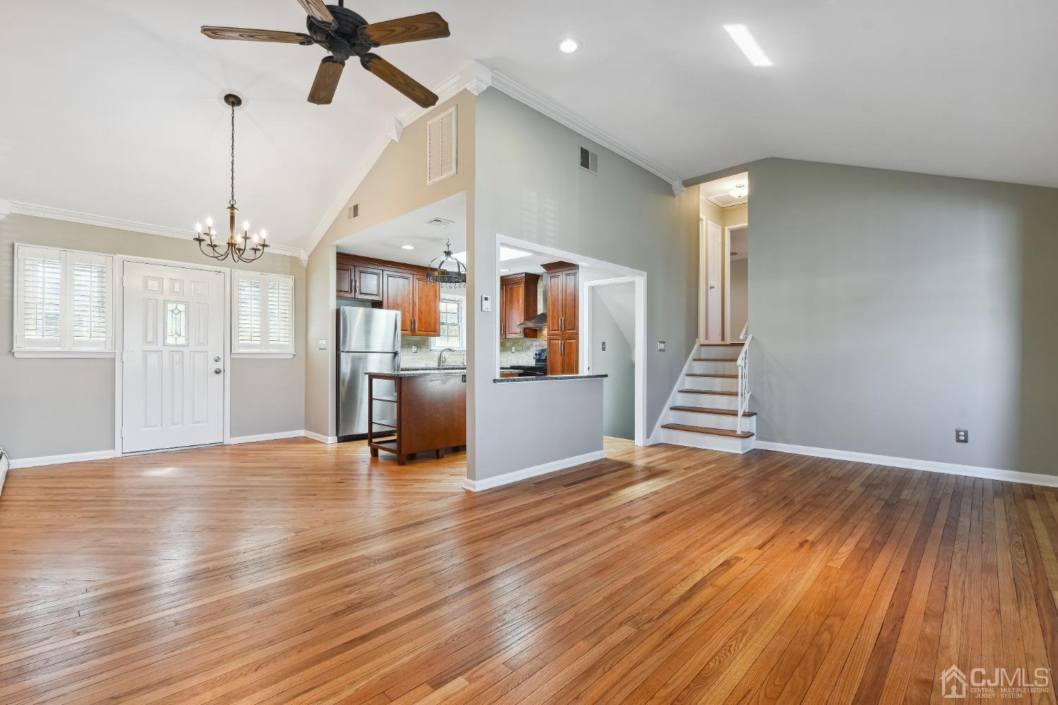 35 Miliken Road Colonia, NJ 07067 - Photo 6 of 23 a view of a kitchen with wooden floor and a ceiling fan