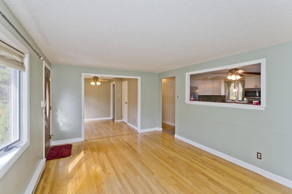 183 Peekskill Avenue Springfield, MA 01129 - Photo 11 of 31 a bed room with a bed and a painting on the wall