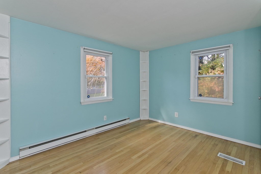 183 Peekskill Avenue Springfield, MA 01129 - Photo 16 of 31 a view of empty room with window and wooden floor