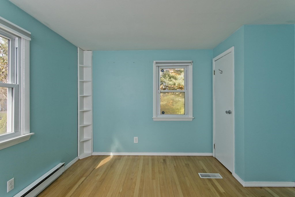 183 Peekskill Avenue Springfield, MA 01129 - Photo 17 of 31 a view of a room with a window and wooden floor