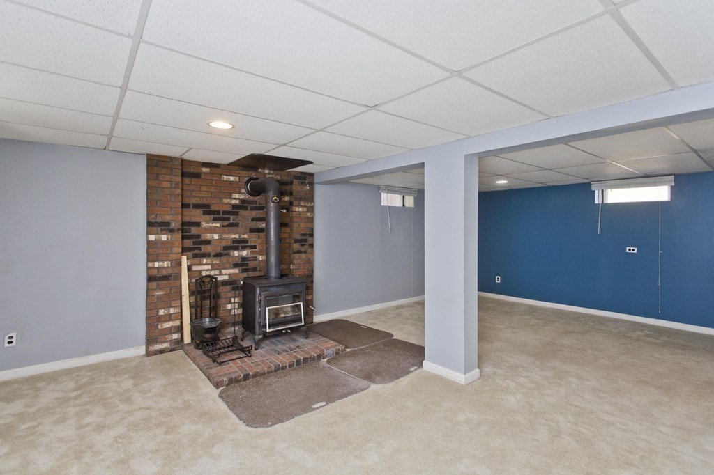 183 Peekskill Avenue Springfield, MA 01129 - Photo 26 of 31 a view of an empty room with shelves and a window