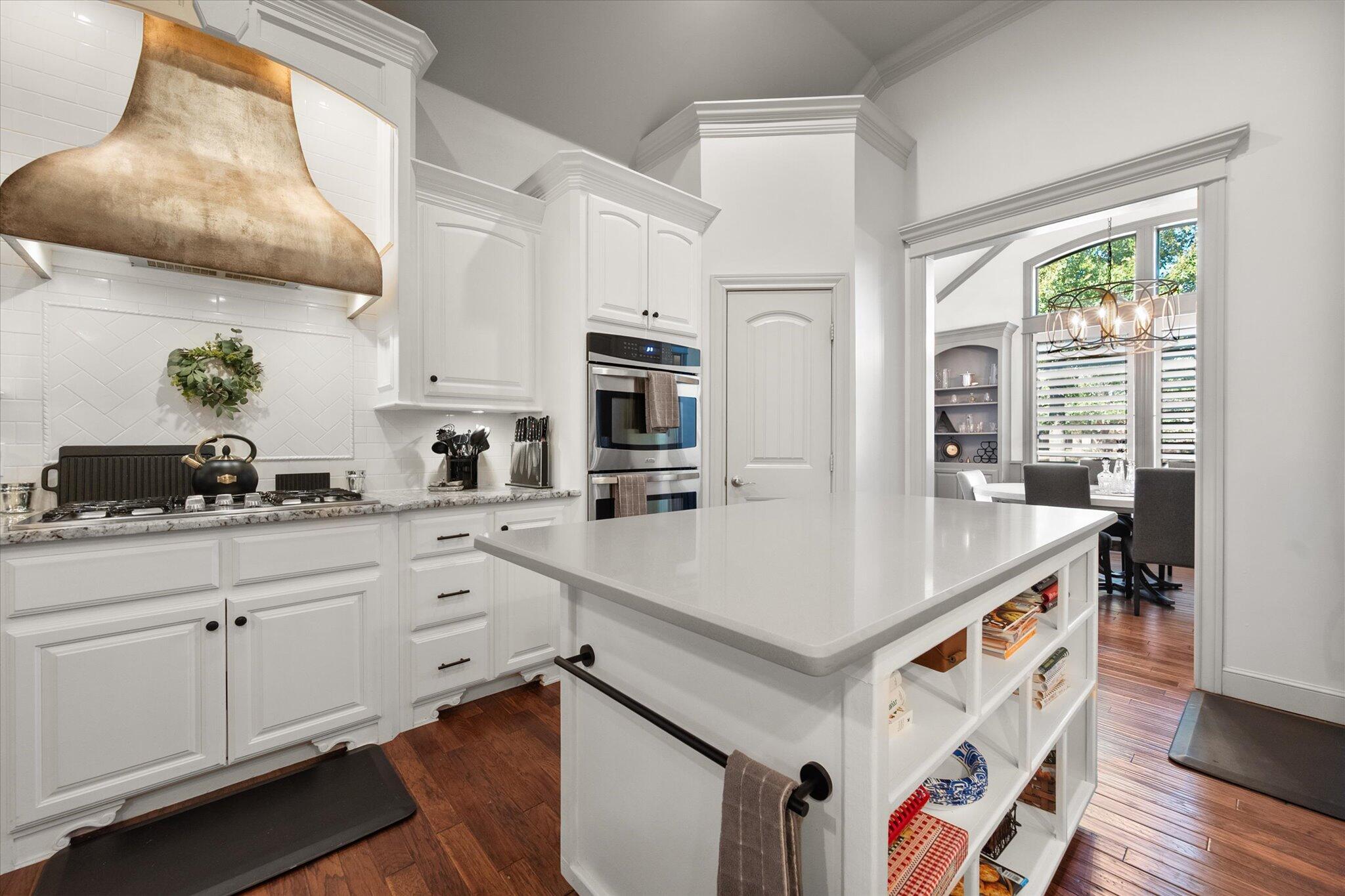 6021 89th Street Lubbock, TX 79424 - Photo 13 of 41 a kitchen with stainless steel appliances a sink and a stove