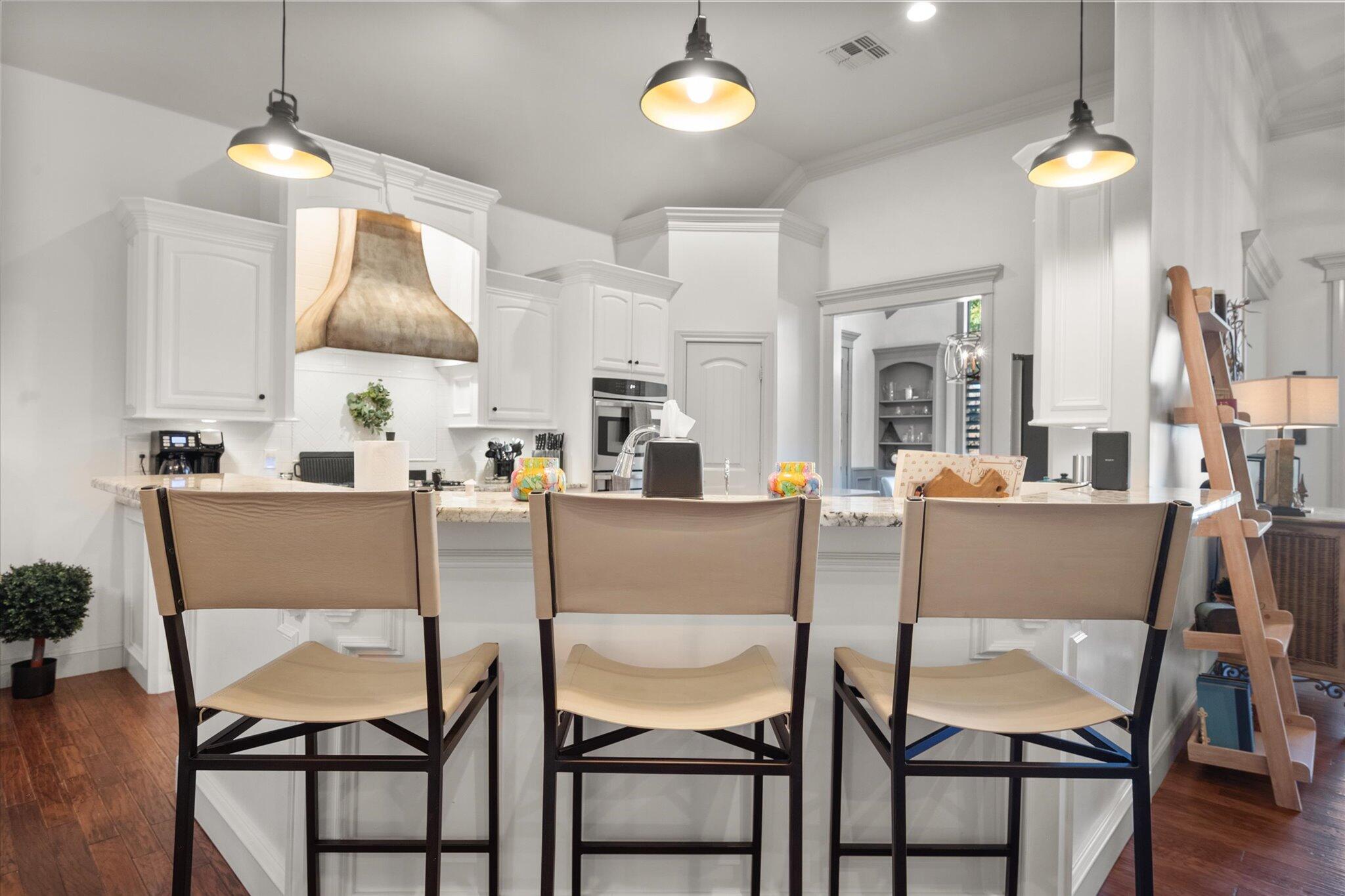 6021 89th Street Lubbock, TX 79424 - Photo 15 of 41 a dining room with furniture and a chandelier