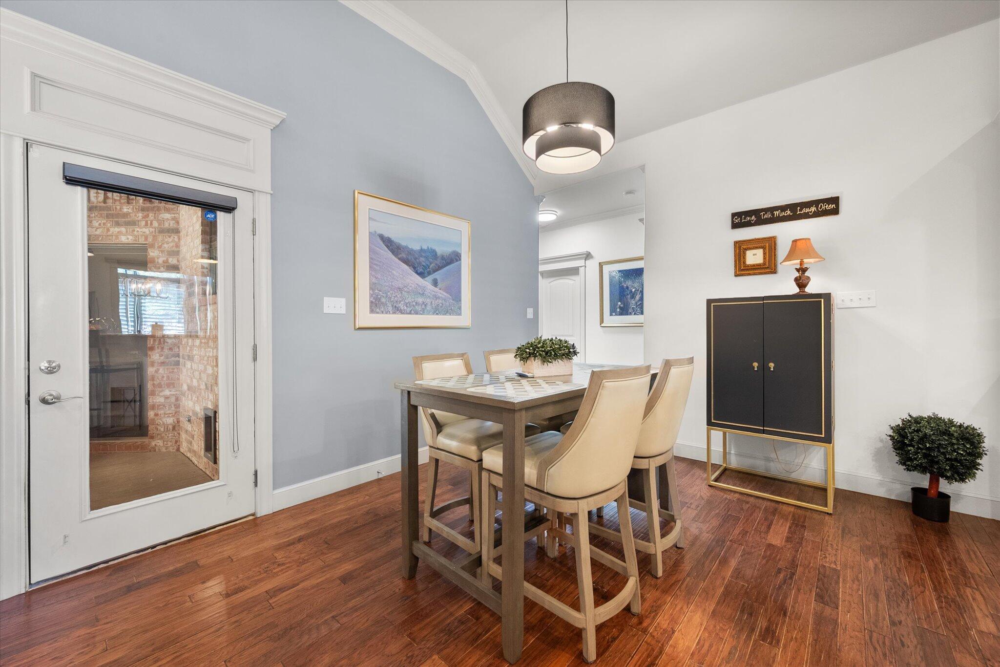 6021 89th Street Lubbock, TX 79424 - Photo 17 of 41 a view of a dining room with furniture and wooden floor