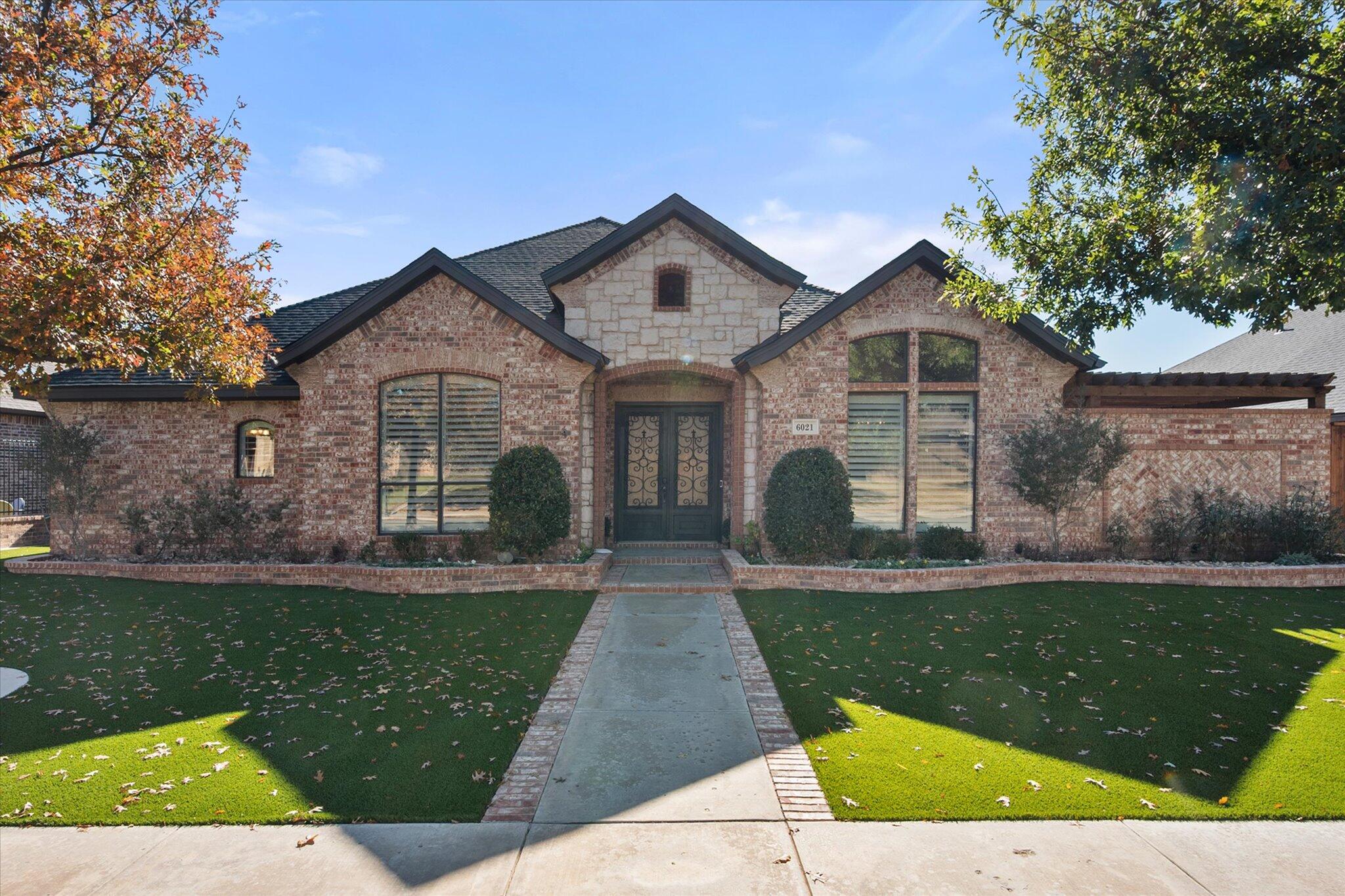 6021 89th Street Lubbock, TX 79424 - Photo 2 of 41 a front view of a house with yard