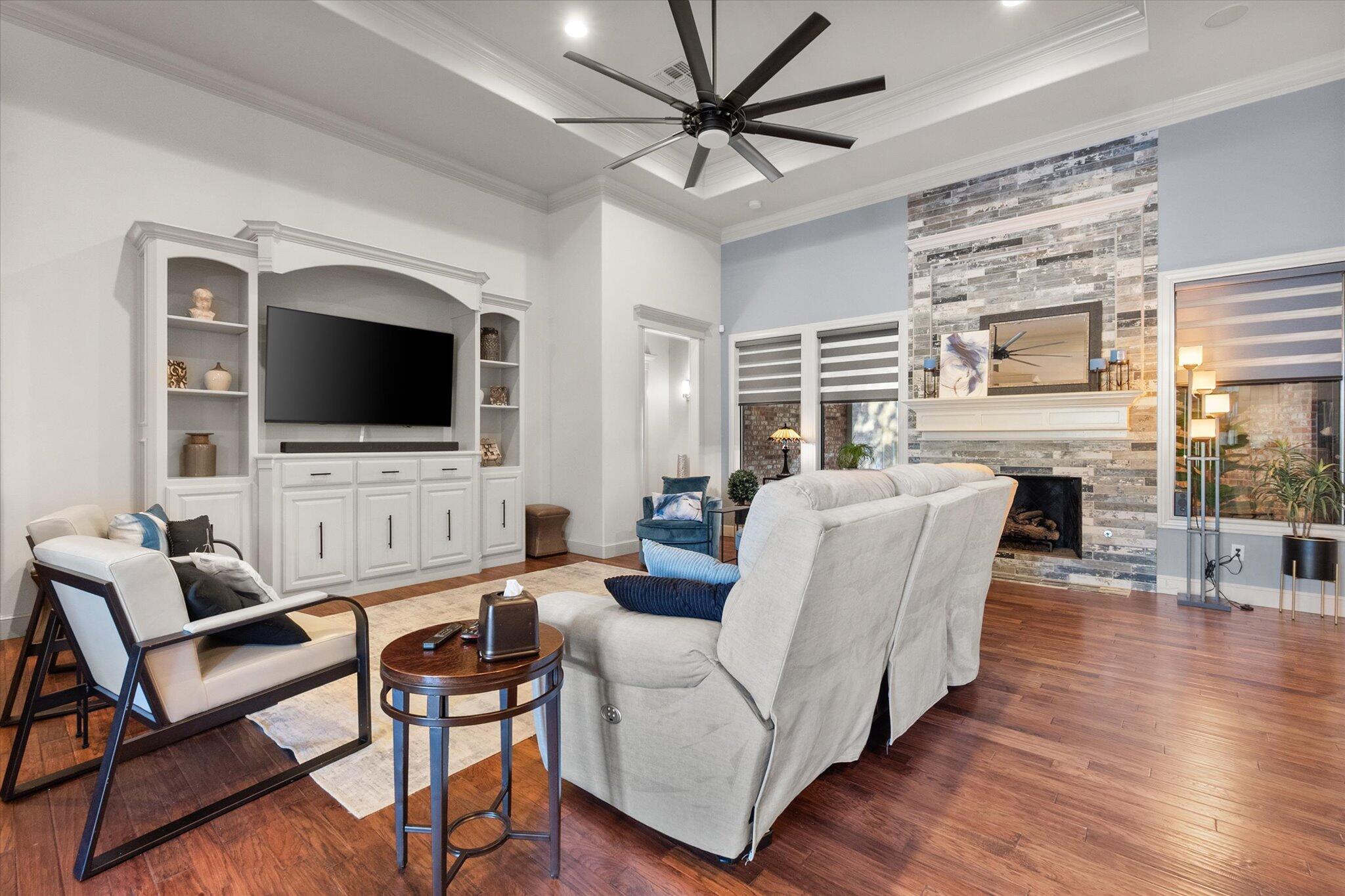 6021 89th Street Lubbock, TX 79424 - Photo 21 of 41 a living room with furniture and a flat screen tv