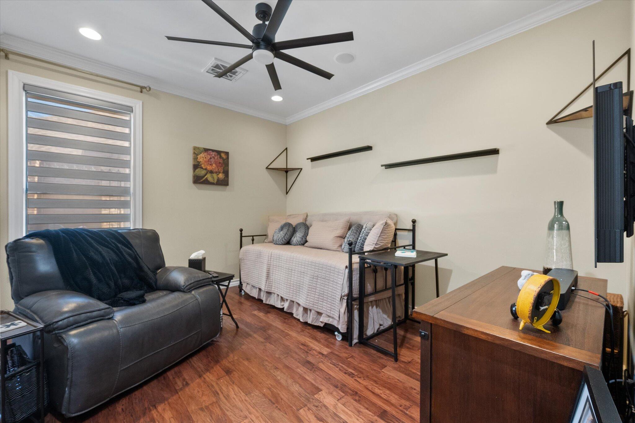 6021 89th Street Lubbock, TX 79424 - Photo 22 of 41 a bedroom with furniture and a window