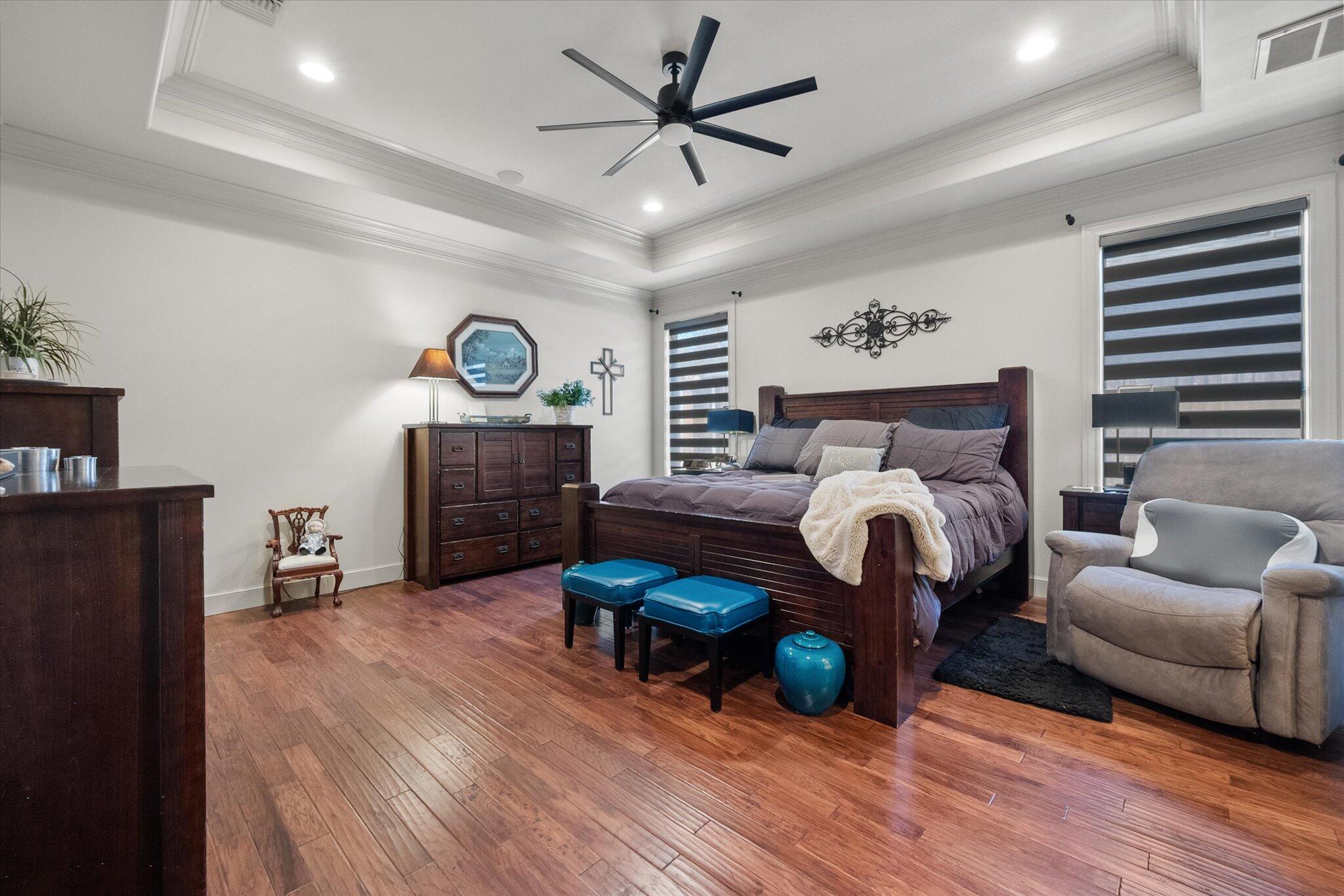 6021 89th Street Lubbock, TX 79424 - Photo 26 of 41 a bedroom with furniture and wooden floor