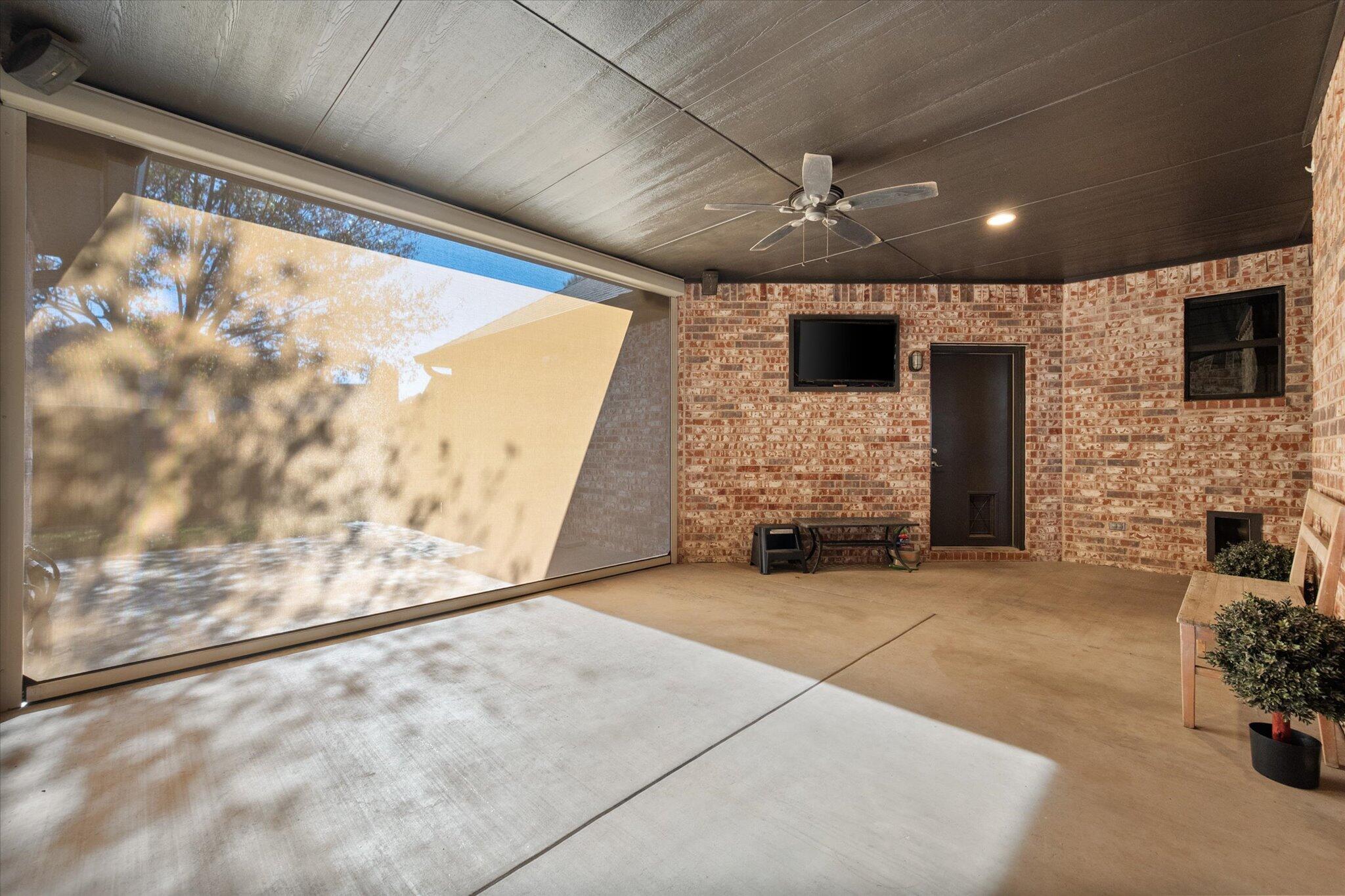 6021 89th Street Lubbock, TX 79424 - Photo 36 of 41 a view of an empty room with a fireplace