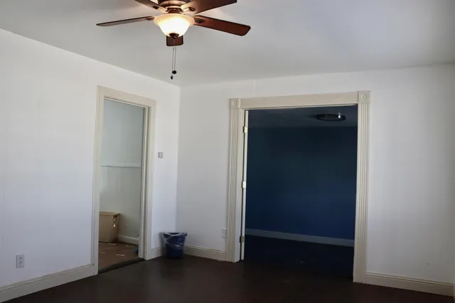 a view of room with window and ceiling fan