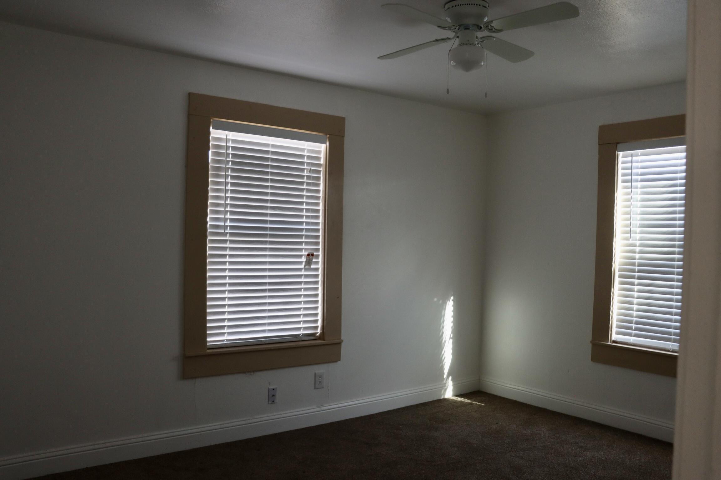 1511 36th Street Lubbock, TX 79412 - Photo 10 of 13 a view of an empty room with a window