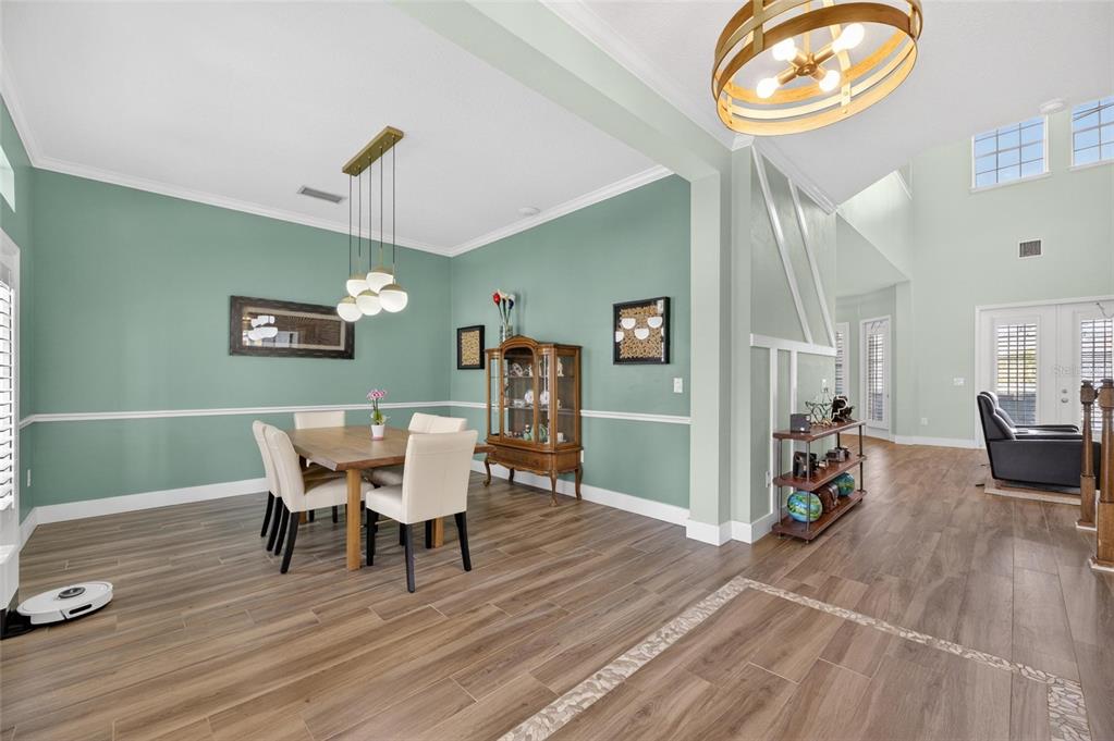 508 Islebay Drive Apollo Beach, FL 33572 - Photo 11 of 98 a view of a dining room with furniture and wooden floor