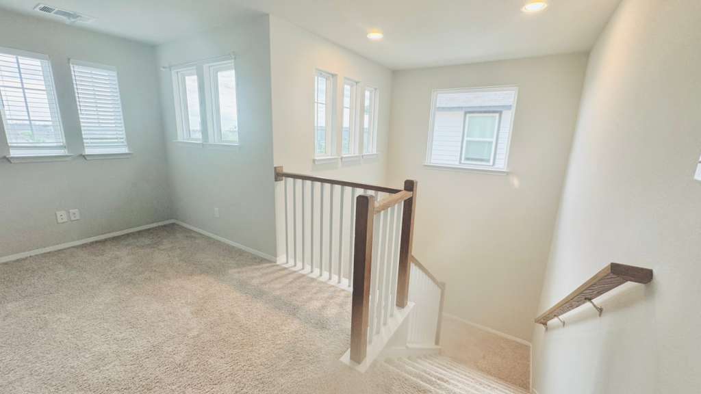 1305 Goforth Road Kyle, TX 78640 - Photo 15 of 23 Stairs featuring carpet and recessed lighting