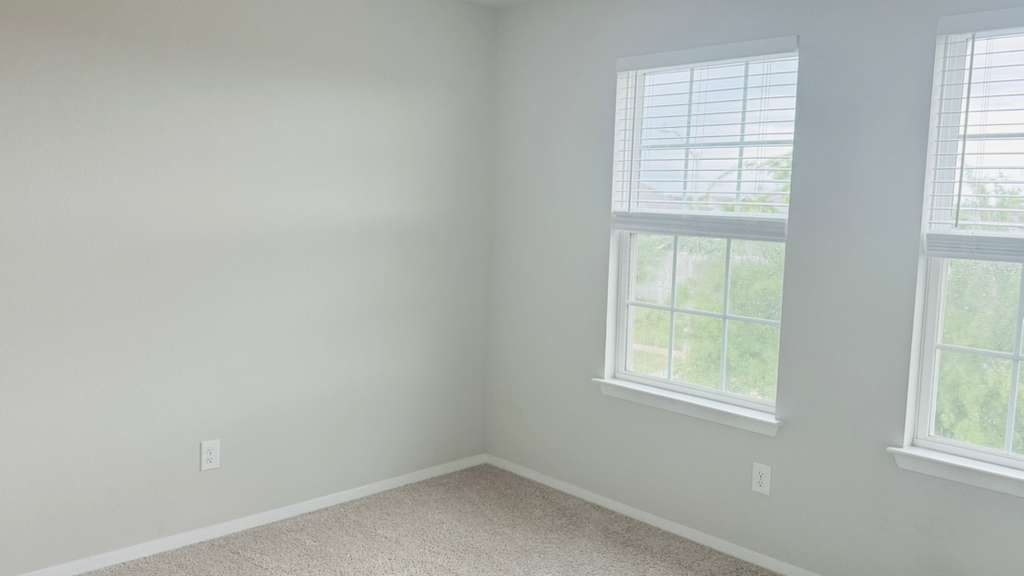 1305 Goforth Road Kyle, TX 78640 - Photo 19 of 23 Spare room featuring light carpet and baseboards