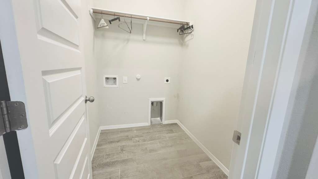 1305 Goforth Road Kyle, TX 78640 - Photo 20 of 23 Laundry room featuring hookup for a gas dryer, electric dryer hookup, and washer hookup