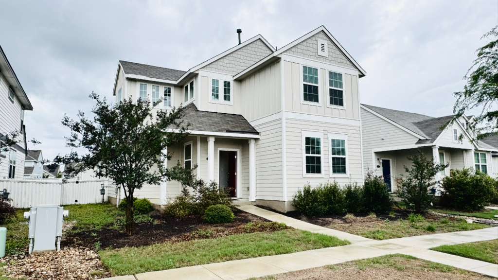 1305 Goforth Road Kyle, TX 78640 - Photo 2 of 23 View of front of home with board and batten siding