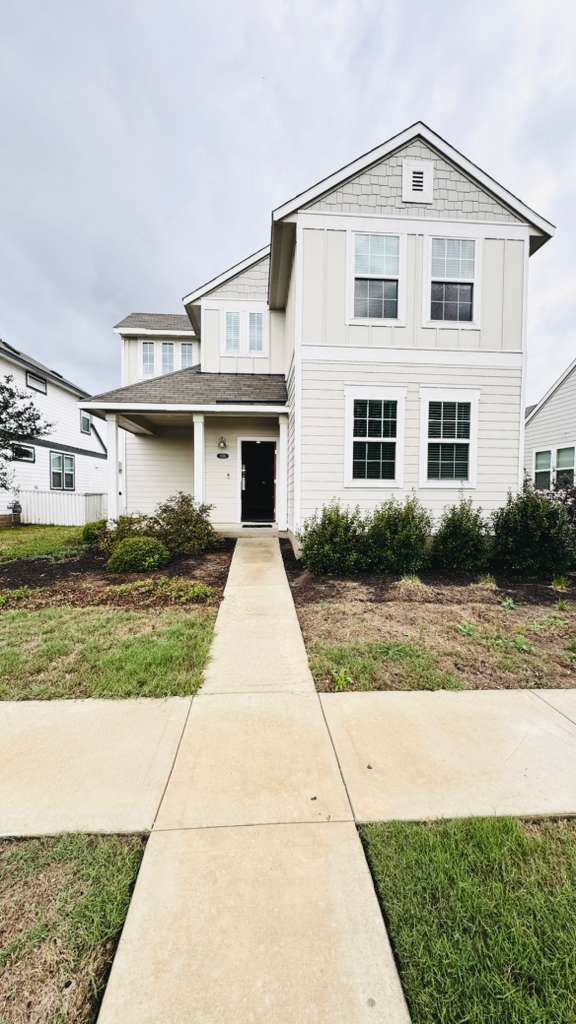 1305 Goforth Road Kyle, TX 78640 - Photo 3 of 23 View of front of house with covered porch and board and batten siding