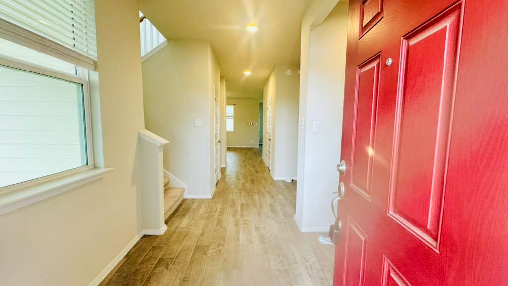 1305 Goforth Road Kyle, TX 78640 - Photo 5 of 23 Entryway with stairs and light wood-style flooring