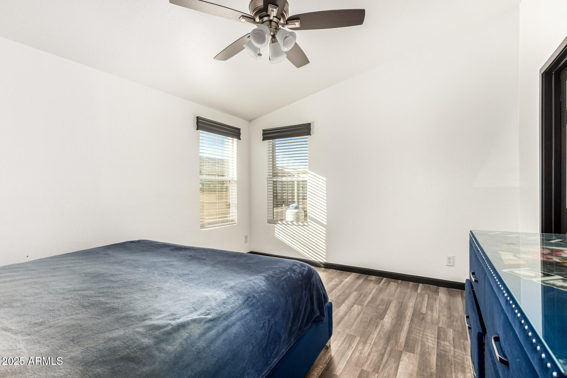 9431 East Coralbell Avenue, Unit 80 Mesa, AZ 85208 - Photo 12 of 22 a view of a livingroom with a ceiling fan and window