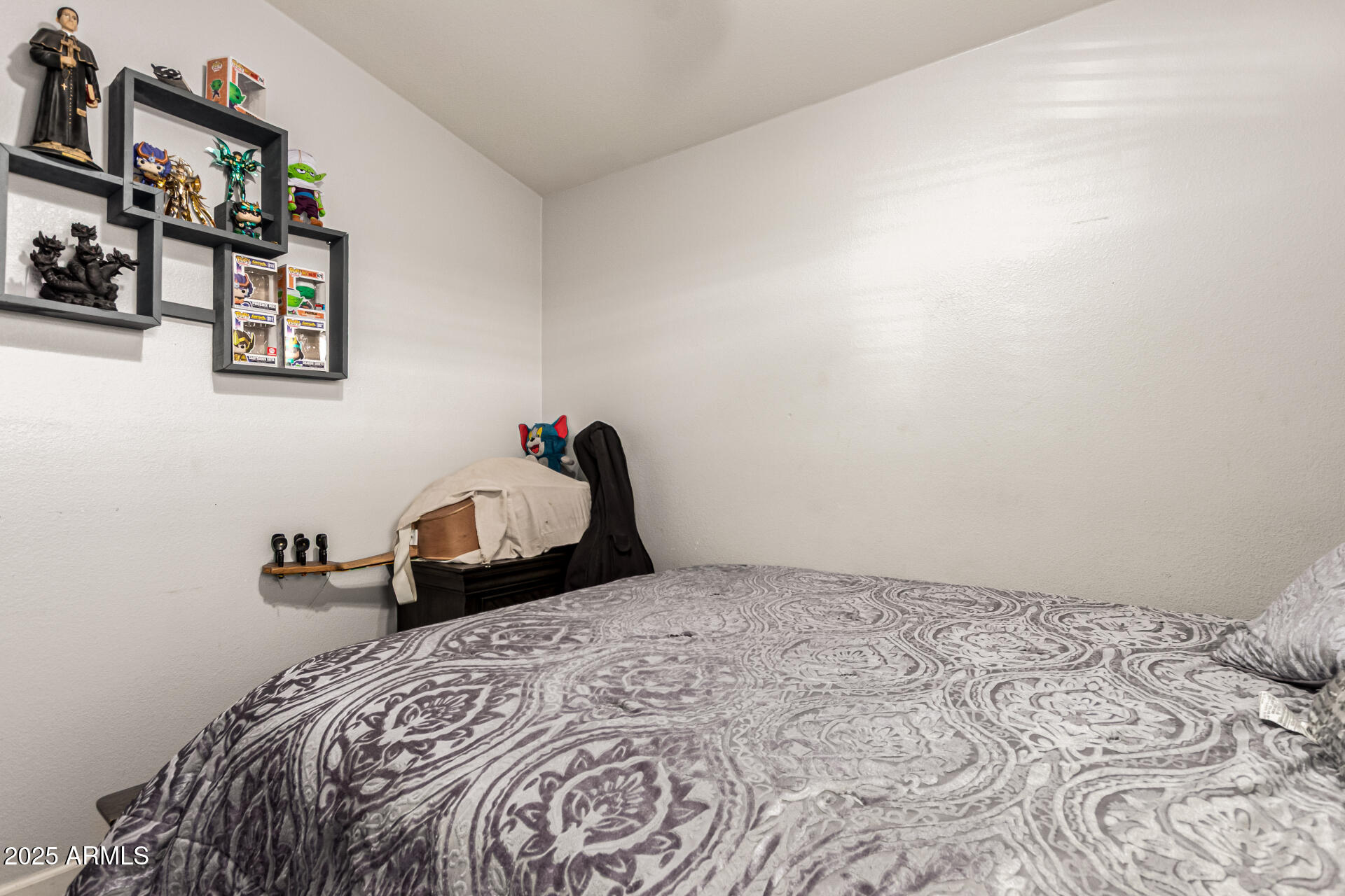 9431 East Coralbell Avenue, Unit 80 Mesa, AZ 85208 - Photo 15 of 22 a bedroom with a bed and a cabinets