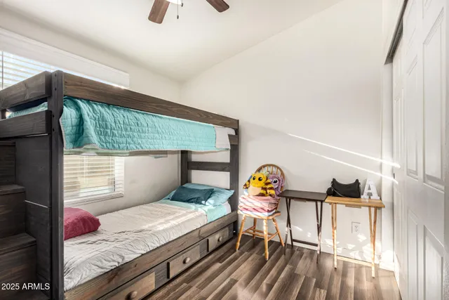 a bedroom with a bed and a table in it