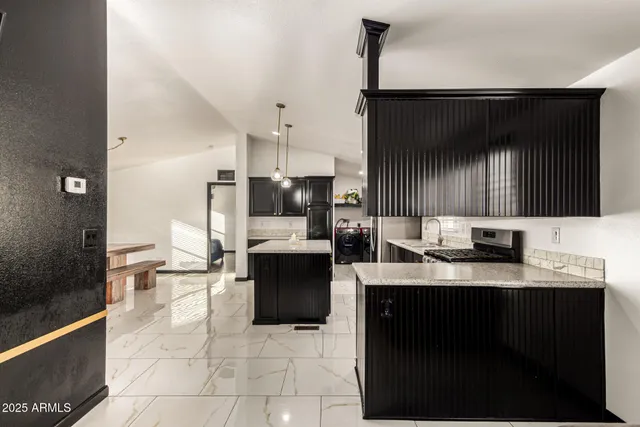 a kitchen with a sink and cabinets