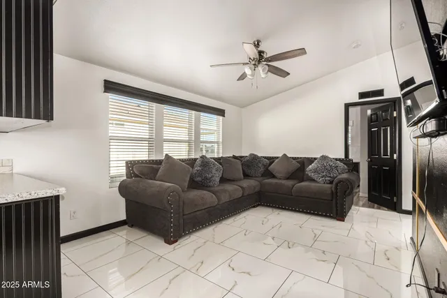 a living room with a couch and a window