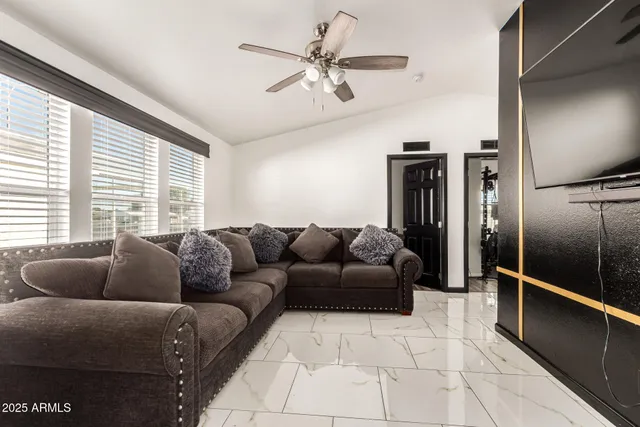 a living room with furniture and a window