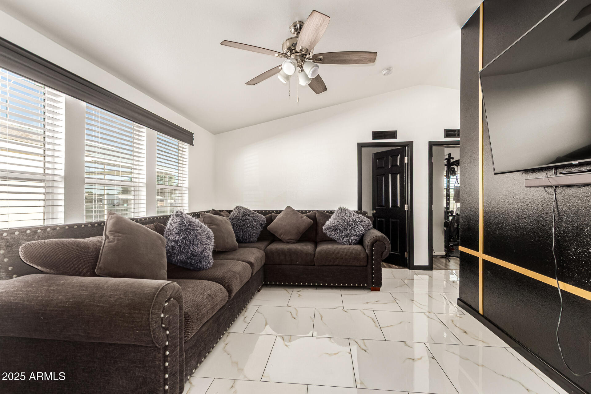 9431 East Coralbell Avenue, Unit 80 Mesa, AZ 85208 - Photo 9 of 22 a living room with furniture and a window