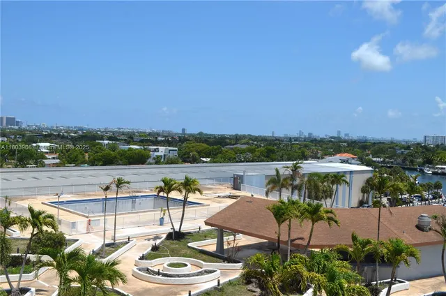 a view of a lake with couches and city view