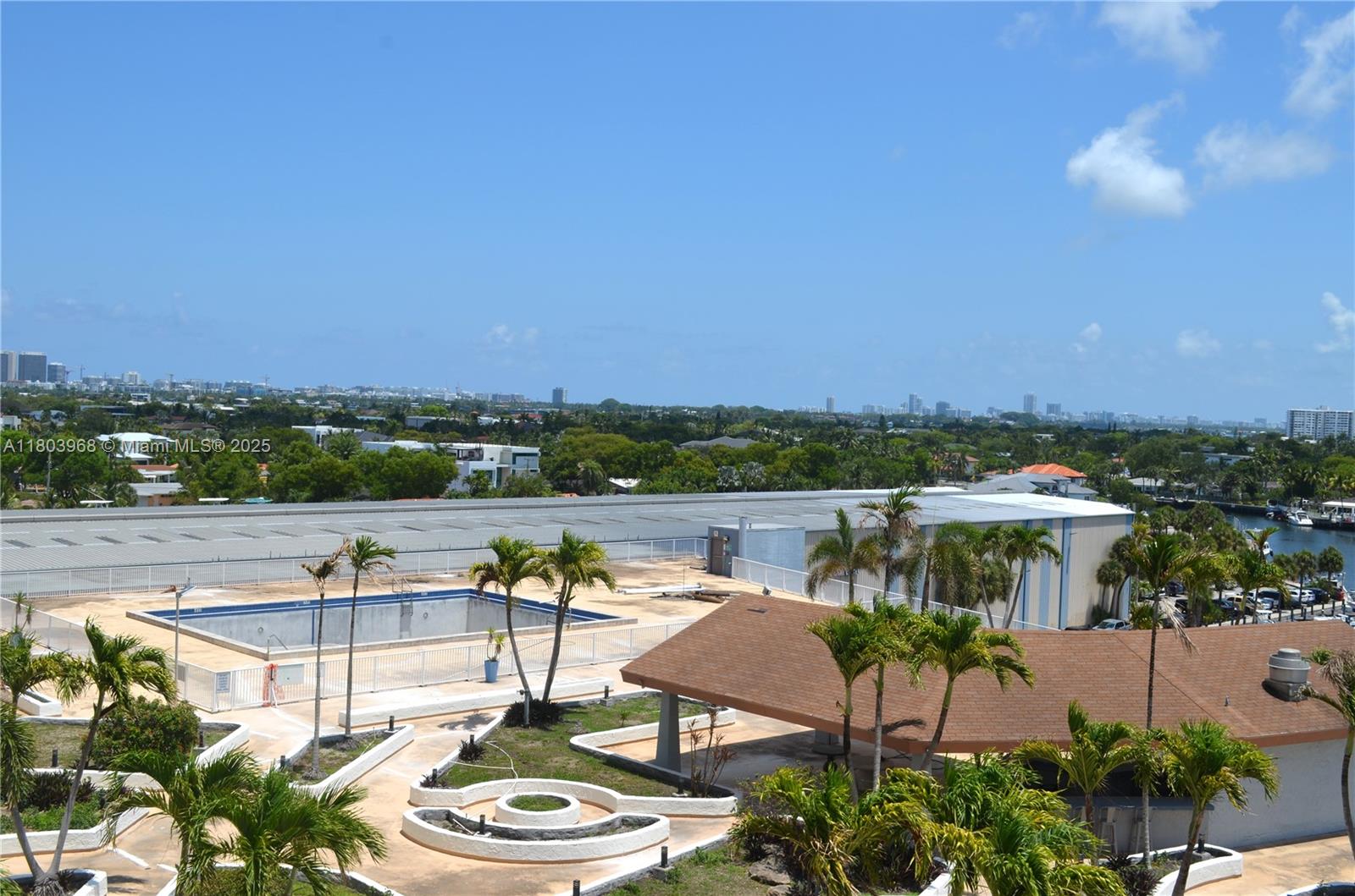 13499 Biscayne Boulevard, Unit 702 North Miami, FL 33181 - Photo 20 of 31 a view of a lake with couches and city view