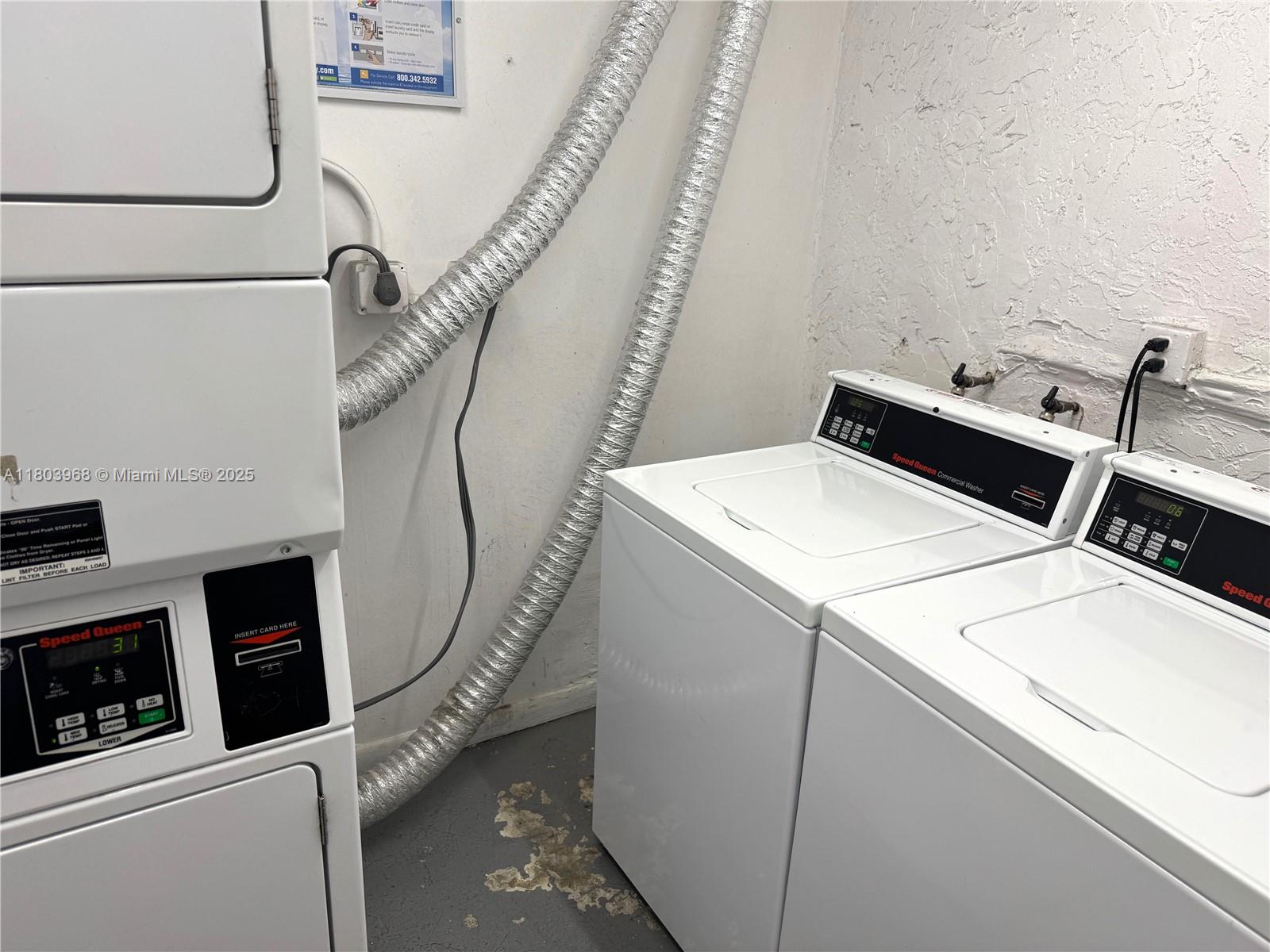 13499 Biscayne Boulevard, Unit 702 North Miami, FL 33181 - Photo 26 of 31 a utility room with dryer and washer