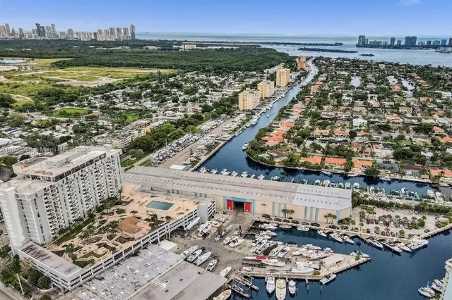 a view of a building and car parked on the road