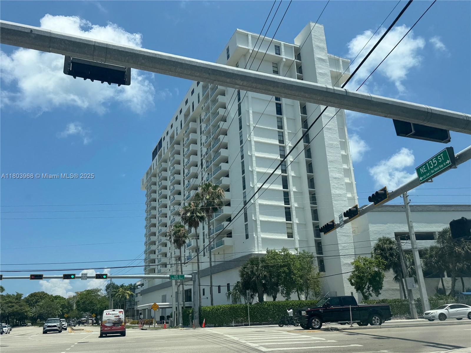 13499 Biscayne Boulevard, Unit 702 North Miami, FL 33181 - Photo 29 of 31 a view of a building and car parked on the road