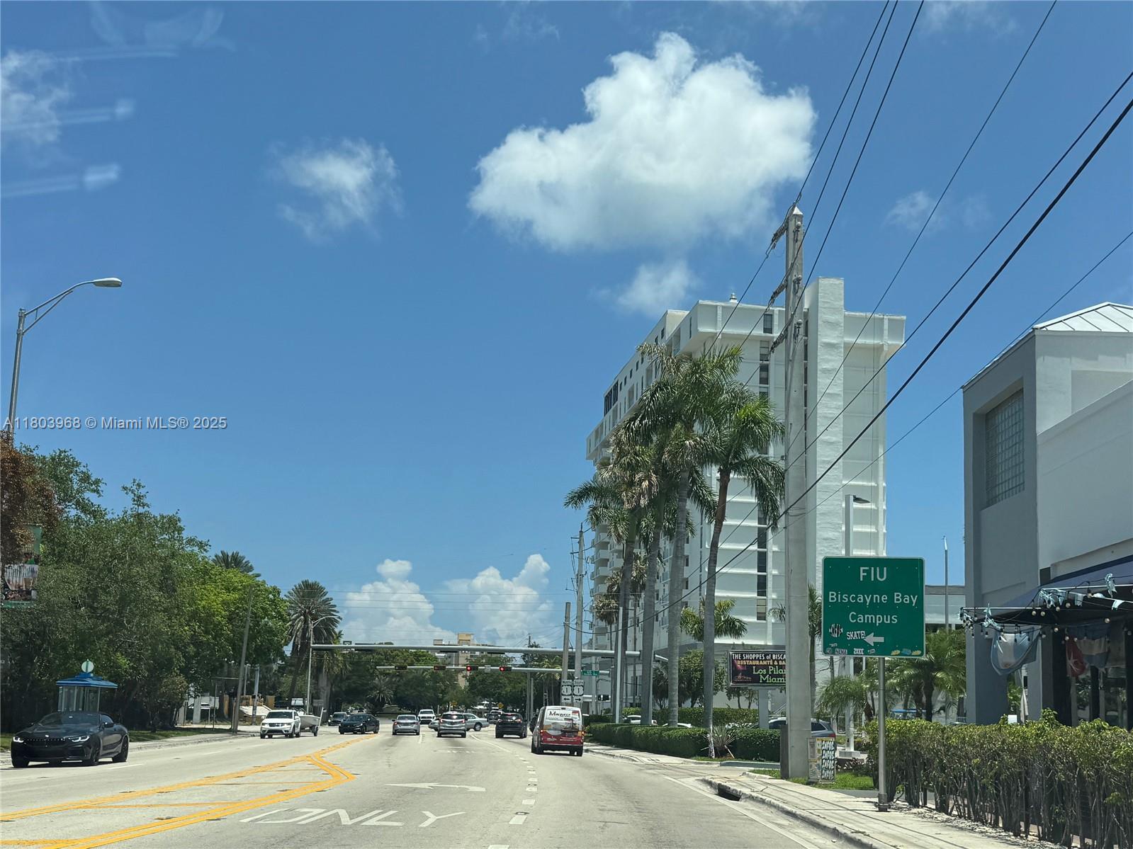 13499 Biscayne Boulevard, Unit 702 North Miami, FL 33181 - Photo 30 of 31 a view of a building with a yard